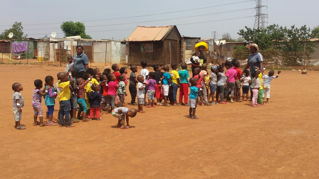The creche kids lined up to leave and amazed at a police helicopter that kept circling overhead!